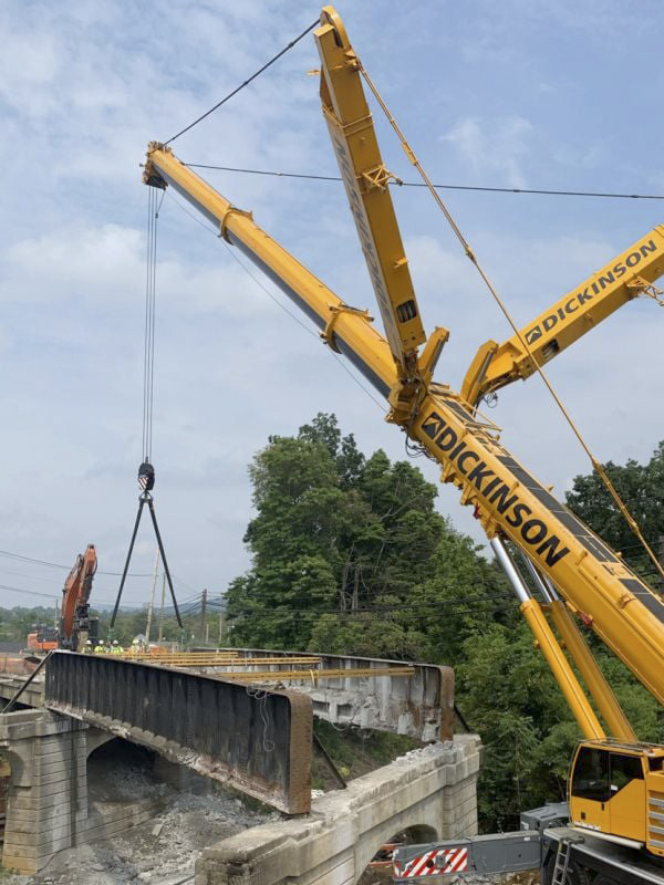 Photo of crane installing bridge supports